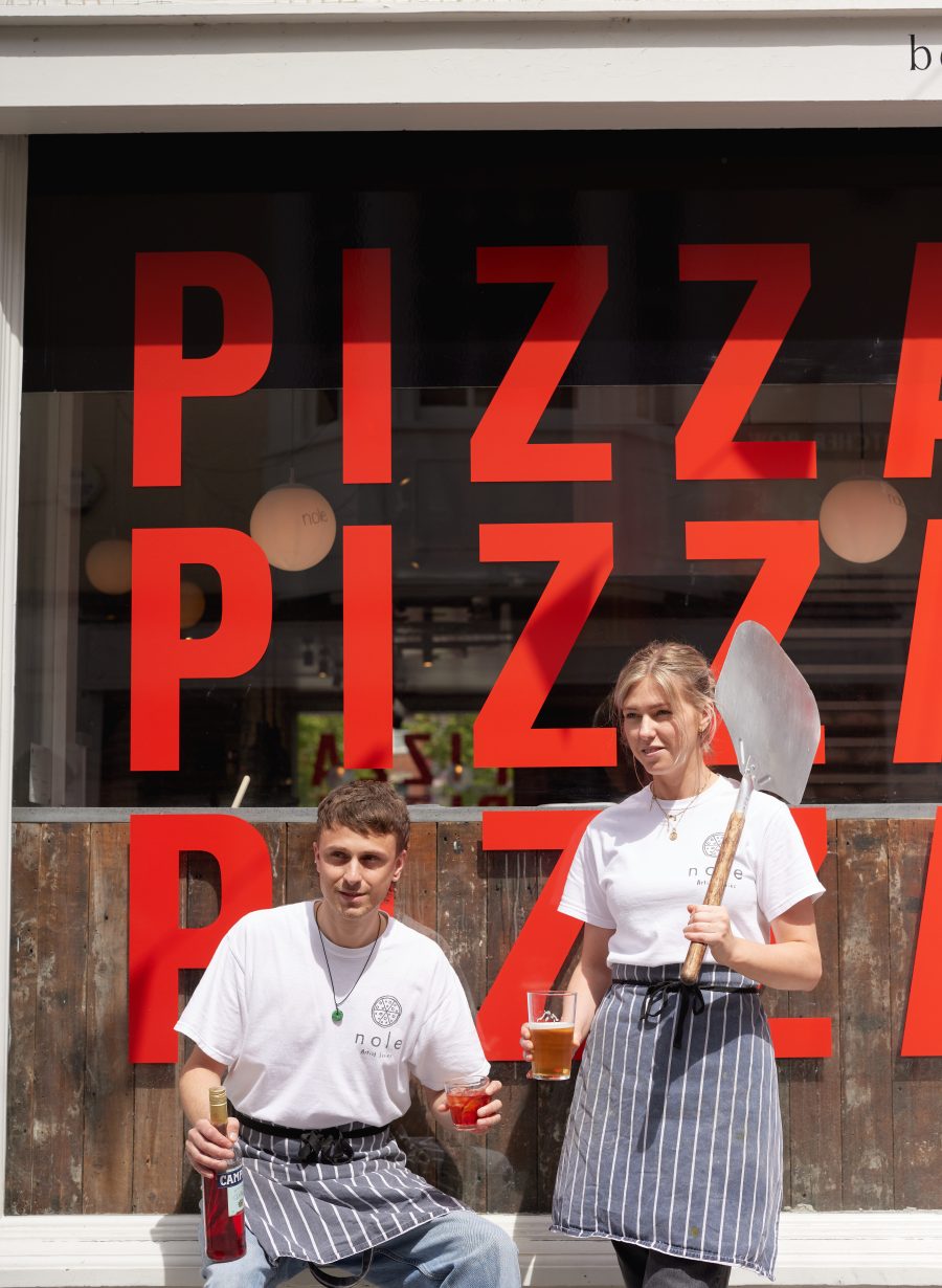 small team outside the pub entrance